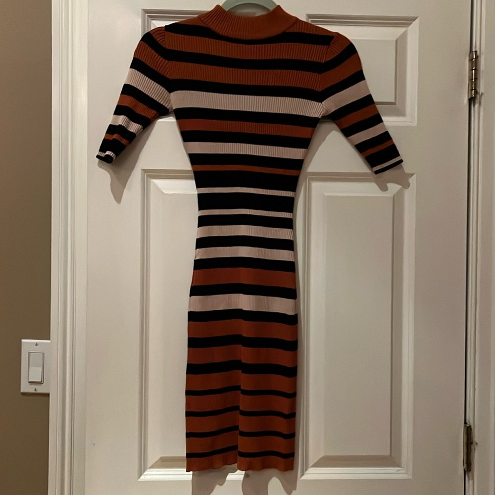 Never worn Beautiful Dress by: say what ? Size small.